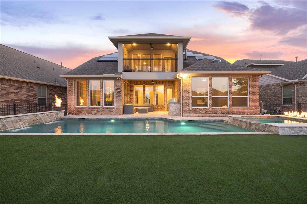 Dip into this Gunite Pebble Tech Sheen Pool with a Hot Tub this summer.