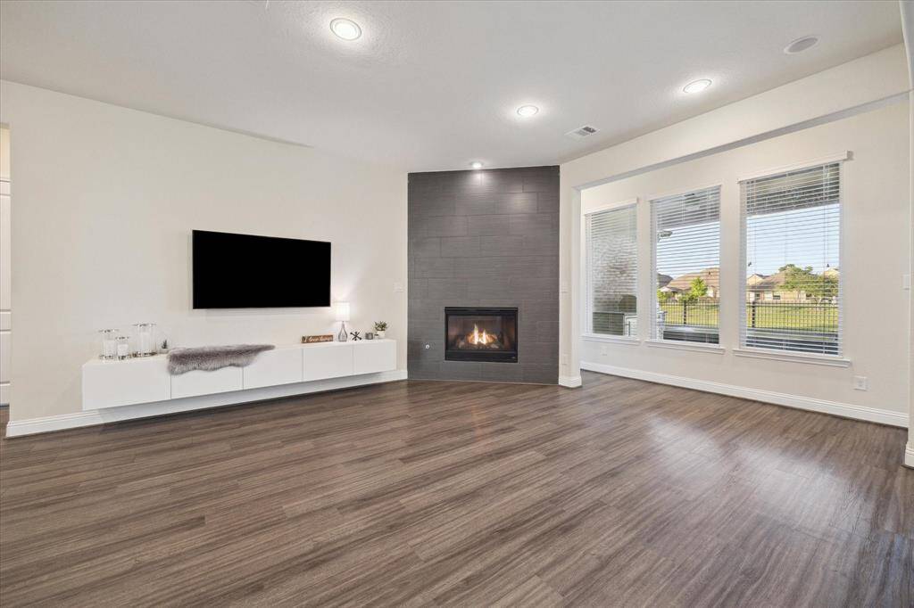 Gas fireplace with a modern floor to ceiling tile display.