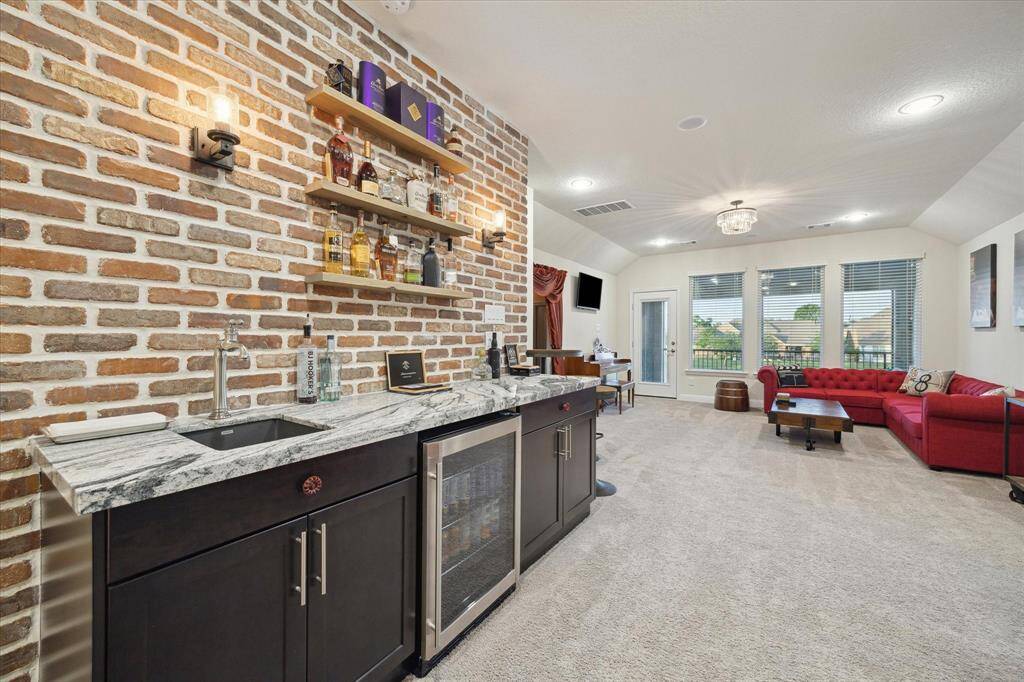 Upon walking upstairs, you will find this custom wet bar with a pub like feel!