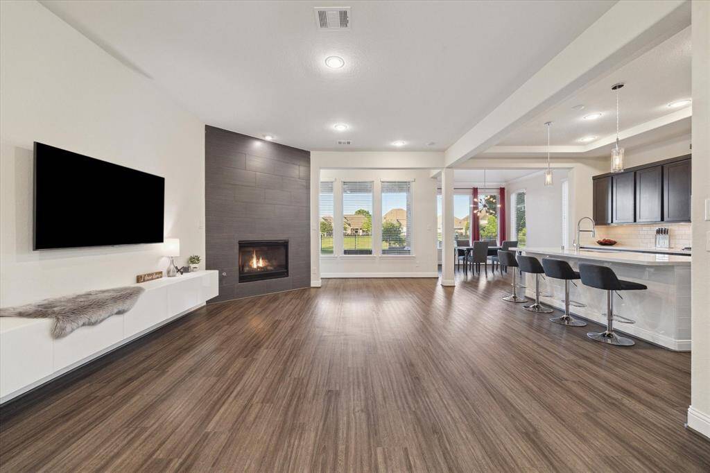 Stunning luxury vinyl plank flooring throughout the main living, kitchen and office areas.