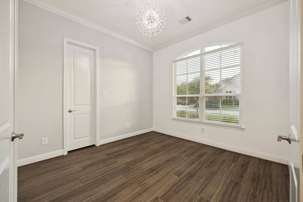 located on the first floor, a bright and modern office space with a large window filling the room with natural light. Also, this could be an optional 5th bedroom with the additional closet.