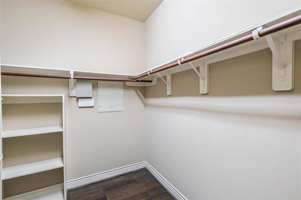 1 of 2 Walkin closets in primary bedroom