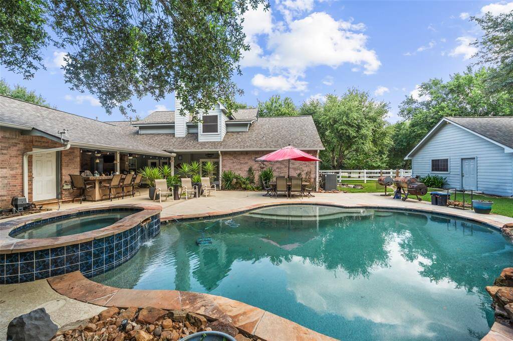 Party like a rockstar in this epic backyard retreat, set on 3 acres with a sparkling pool, raised spa and room for all your favorite people. Fire up the summer kitchen, crank the tunes under the covered patio, and soak up the good vibes all day (and night) long.