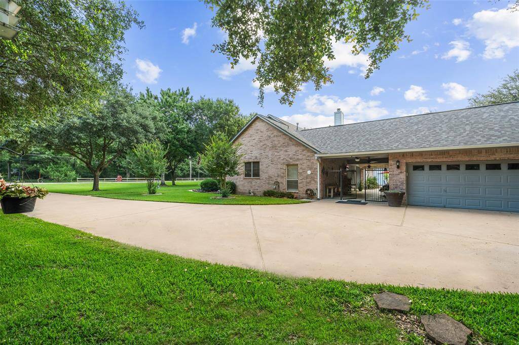 In addition to the 2-car attached garage and extra driveway parking, this property features a separate pool house with a full bath and shower, plus a 30x40 Hawthorne steel building with rolling bay doors offering outstanding versatility for storage, hobbies, or workshop space.