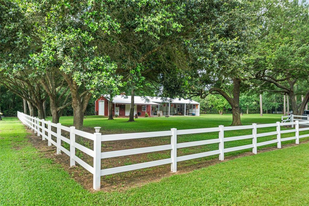 Towering trees, cross fencing, and a blanket of lush green grass set the scene on this beautiful 3-acre property. A 24-zone sprinkler system keeps everything looking its best, making this sprawling estate as functional as it is picturesque, perfect for relaxing, entertaining, and enjoying plenty of room to roam.