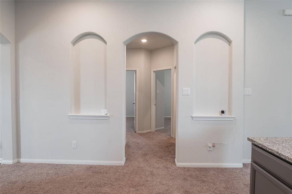 Hallway to Bedrooms, Laundry, and Garage