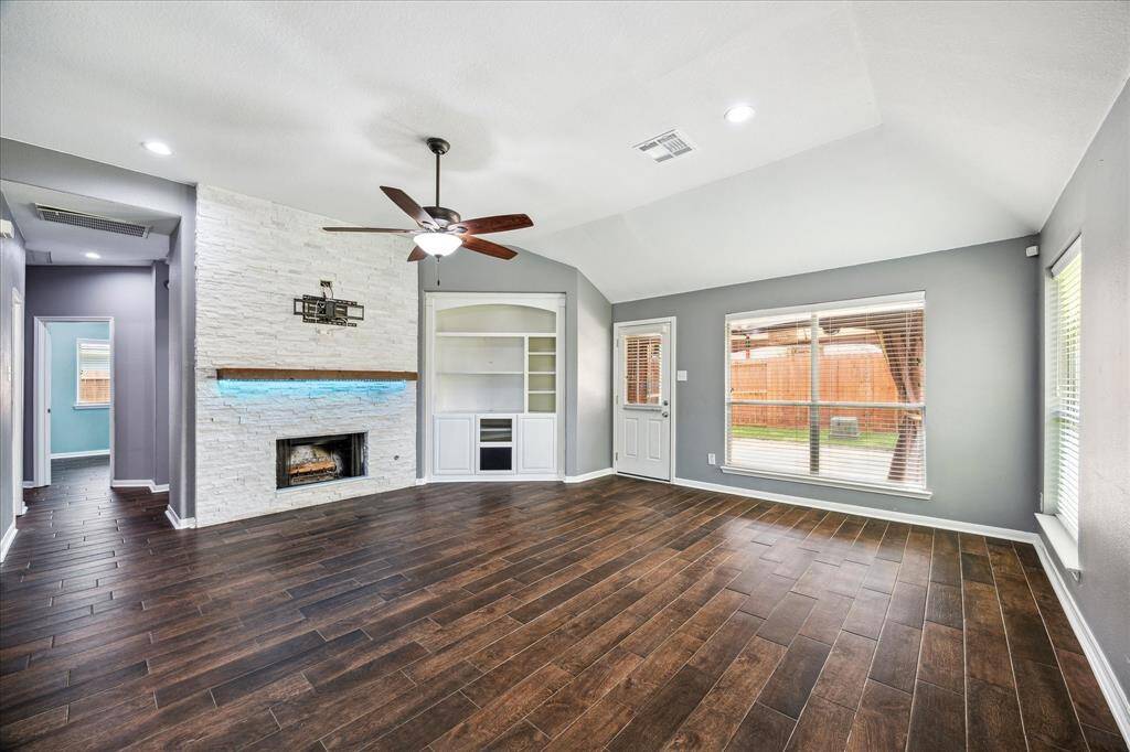 Custom Built-Ins & Fireplace Accent the Living Space