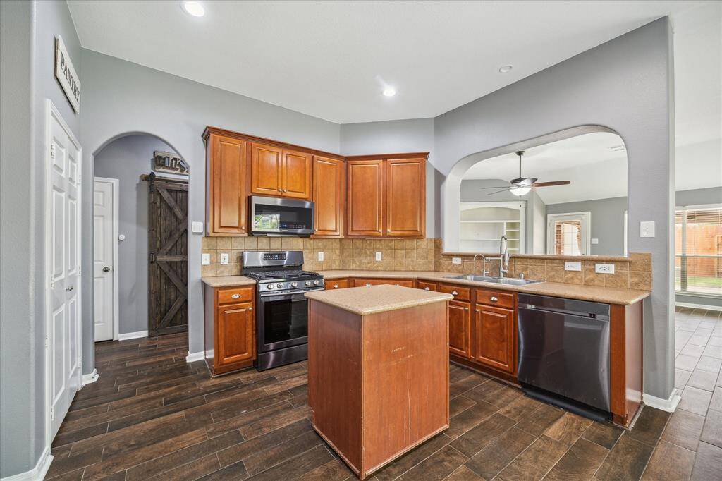 Ample counter space with a rolling island for your convenience