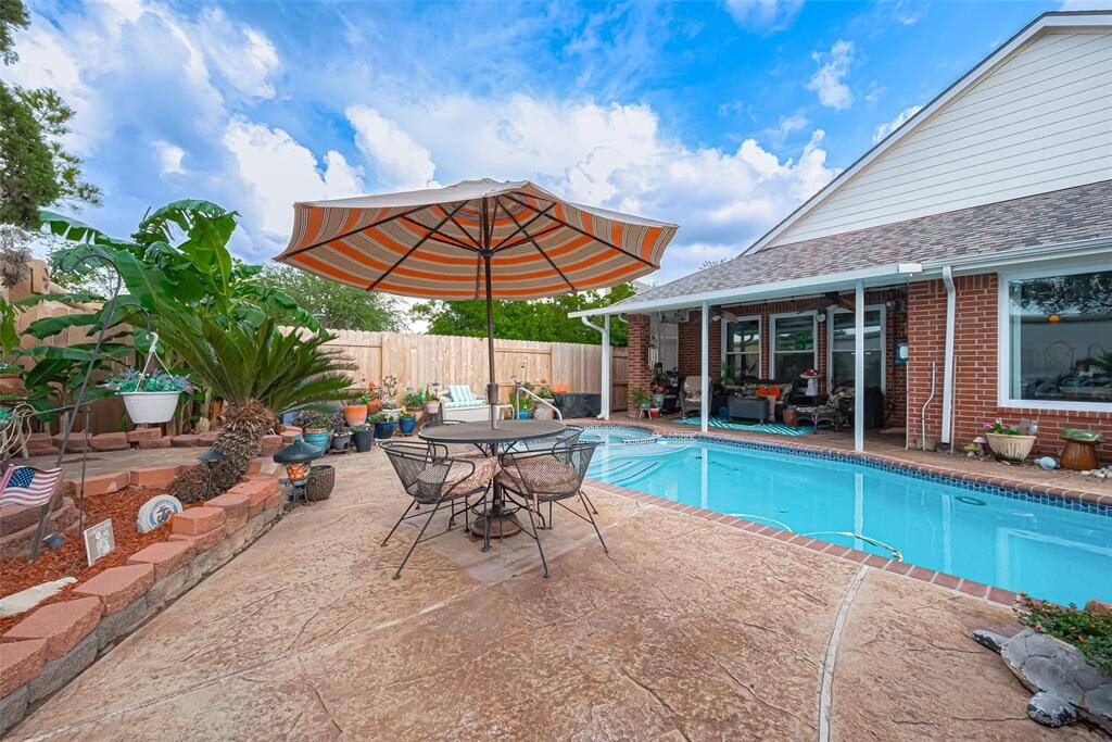 The beautifully landscaped yard enhances the outdoor  experience, creating a serene resort-like atmosphere