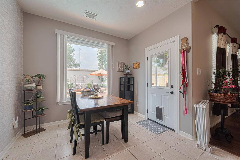 Enjoy serene pool and landscape views through the stunning picture window