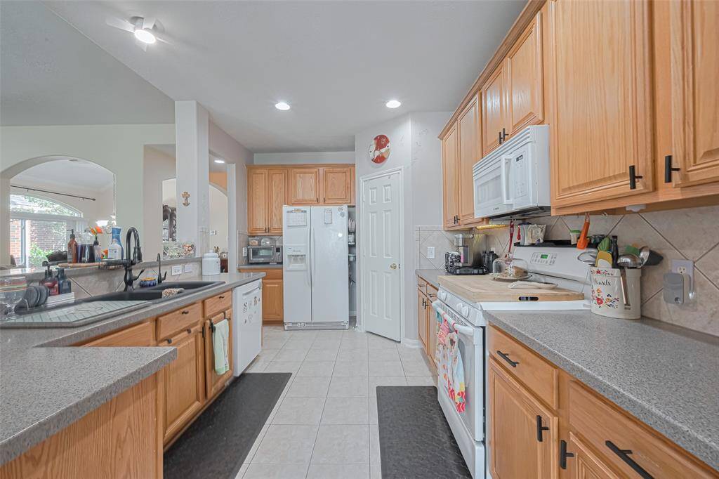 Freshly steamed tile floors and sparkling grout gives the kitchen a clean refreshed look