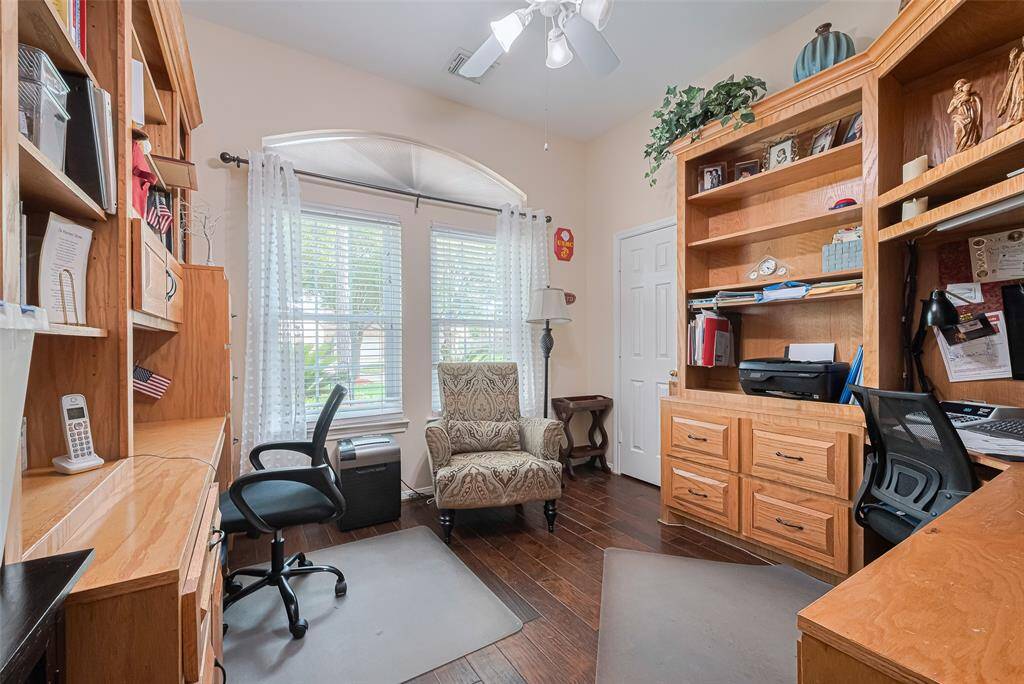 The 4th bedroom has been expertly transformed into a home office, featuring custom built cabitnetry and two desk centers for optimal productivity