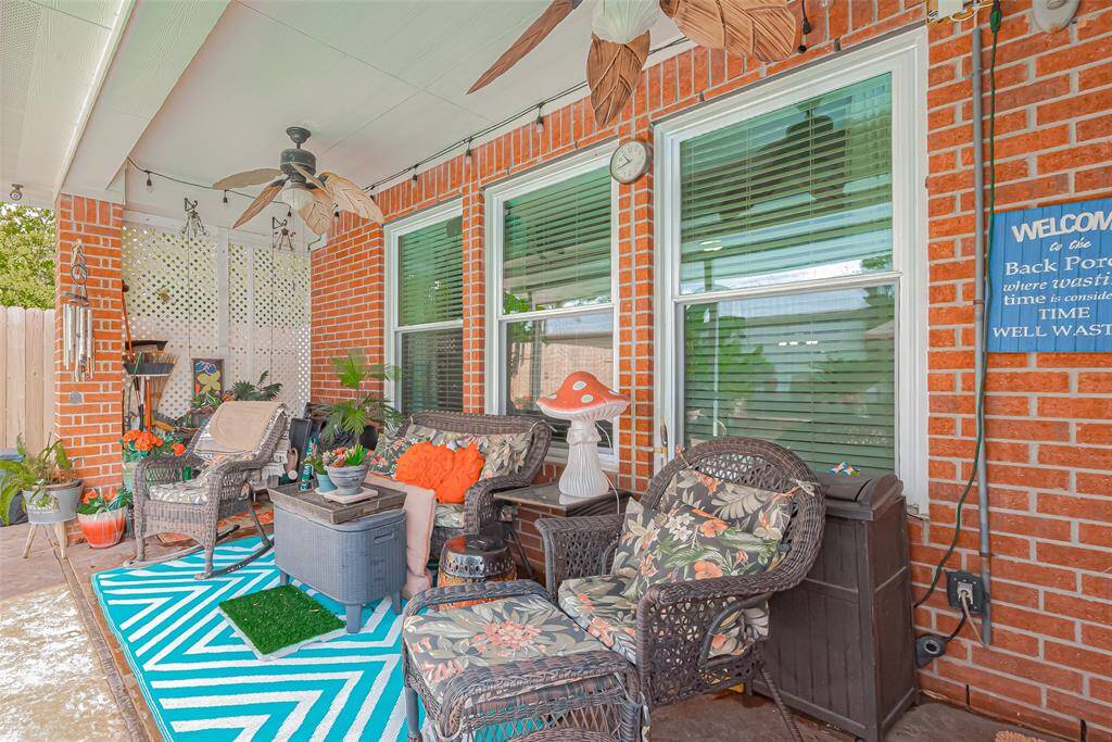 The covered patio, just steps from the pool, provides the perfect spot for relaxing or entertaining in all weather