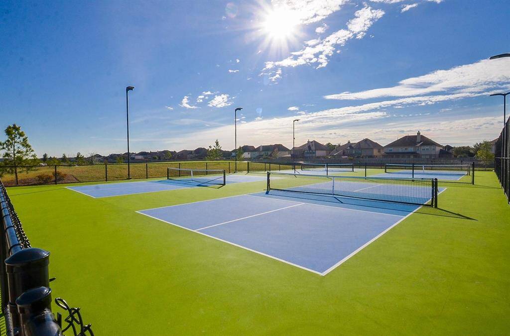 Four dedicated pickle ball courts with lights