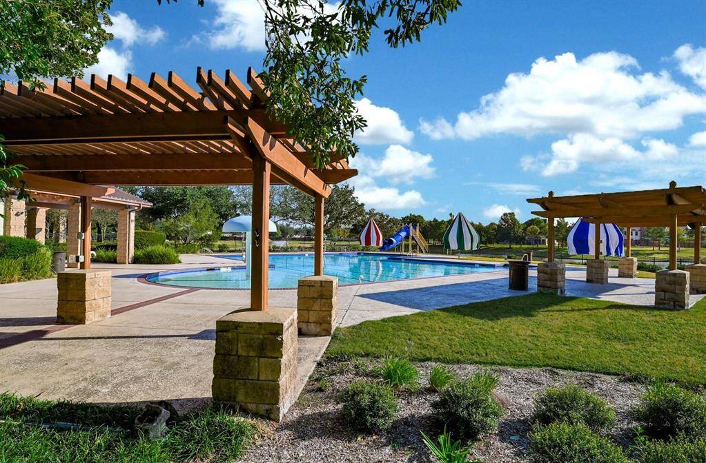 The lakehouse features a lap pool with cabanas