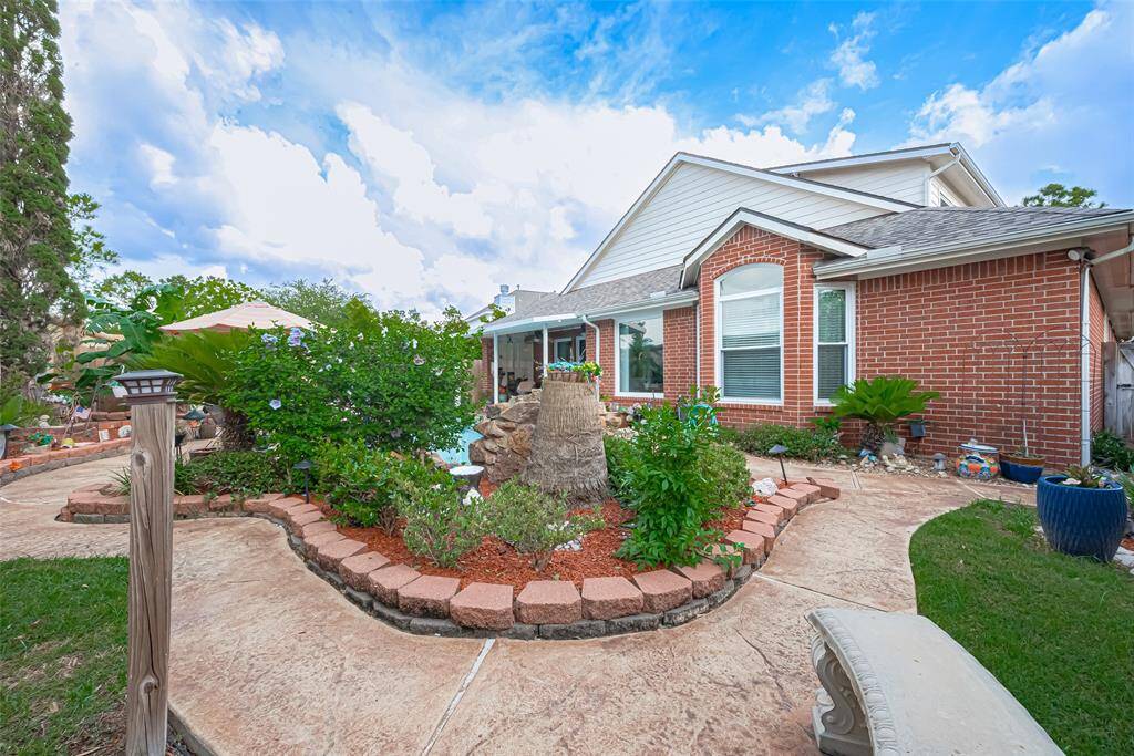 Stamped pavers pathway lead you through the lush grounds adding elagance and charm to the space