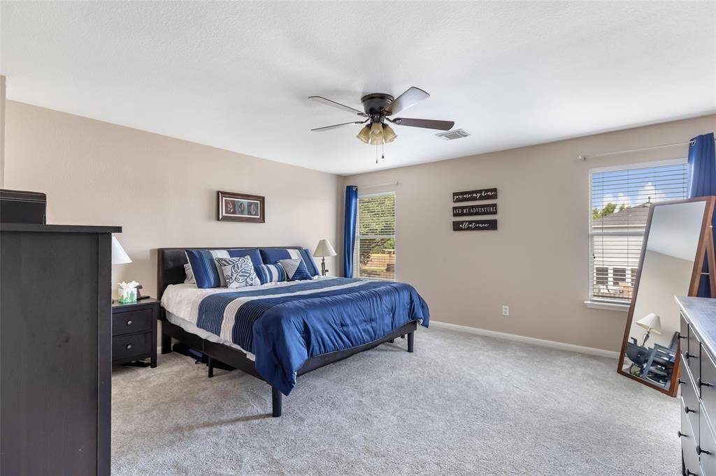 Owner's retreat is located  UPSTAIRS! Brand new carpet just installed!~ It is spacious and provides a back yard view.