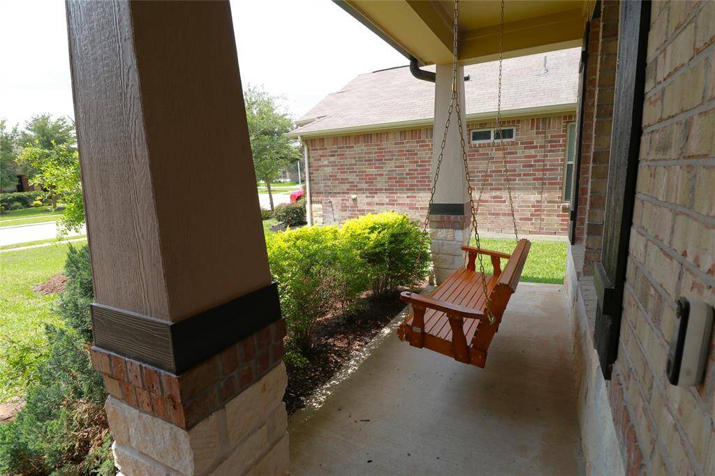 Front porch with new swing.
