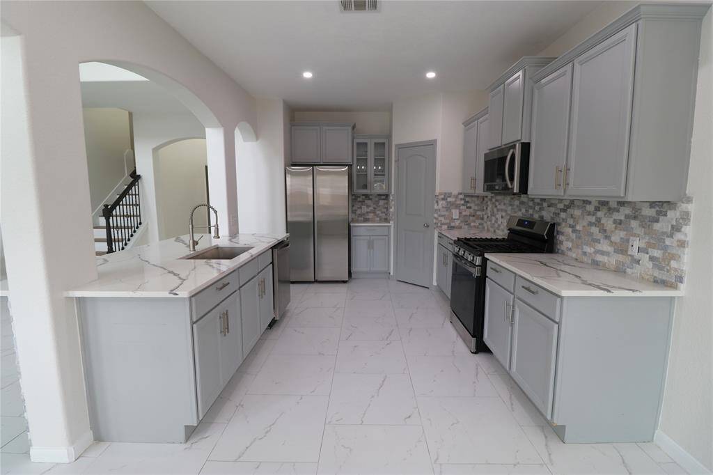Spacious kitchen which opens into the living room.