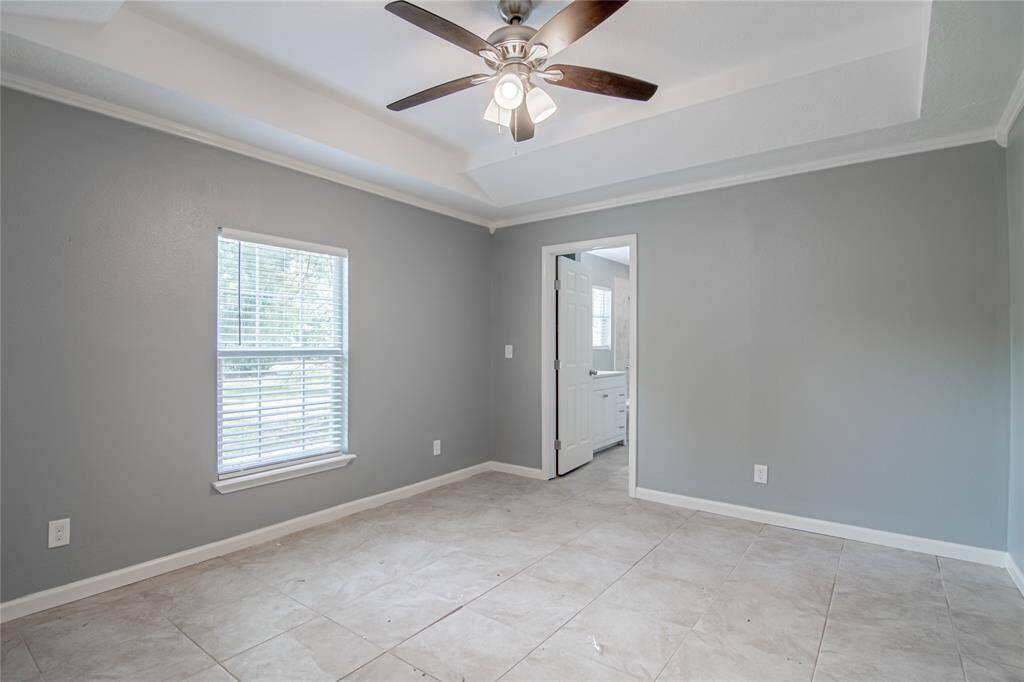 Primary bed room looking to primary bath.