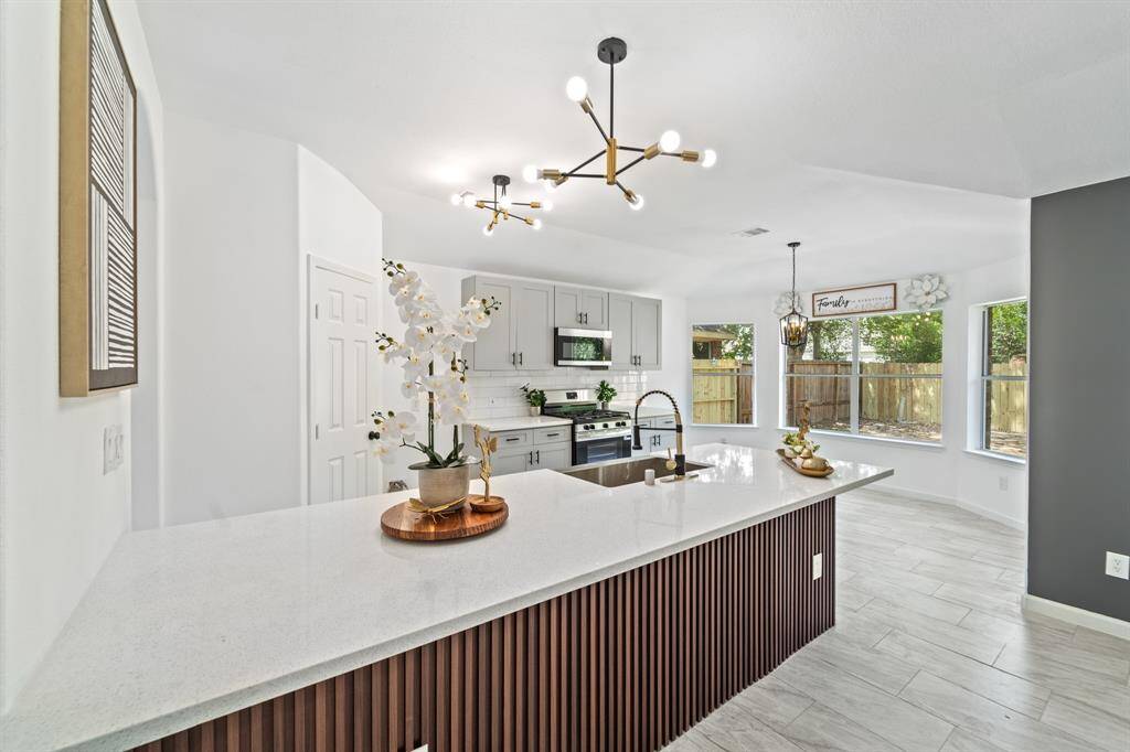 This beautiful home was remodeled with functions and style! slate flute kitchen island adding such a great touch to the house