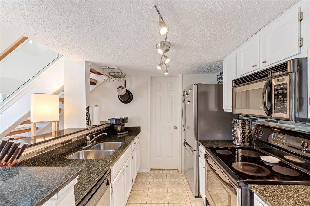 This charming kitchen featuring modern appliances for convenience and style!