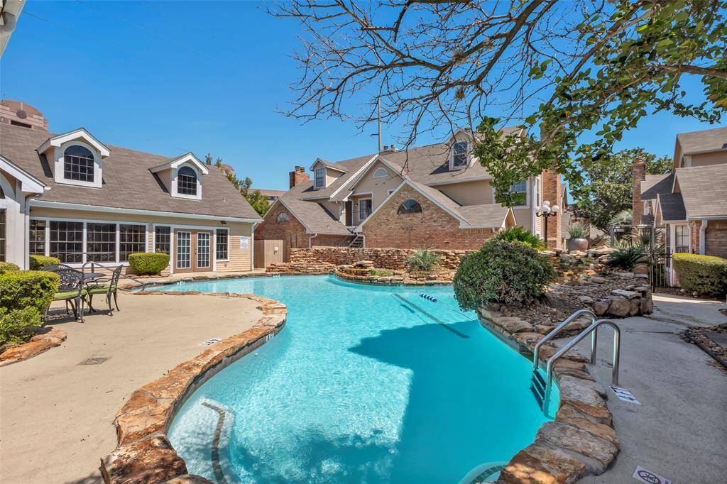 Unwind at the meticulously maintained community pool, a peaceful oasis just moments from your doorstep. This pool is one of three throughout the complex, ensuring plenty of space to relax and enjoy.