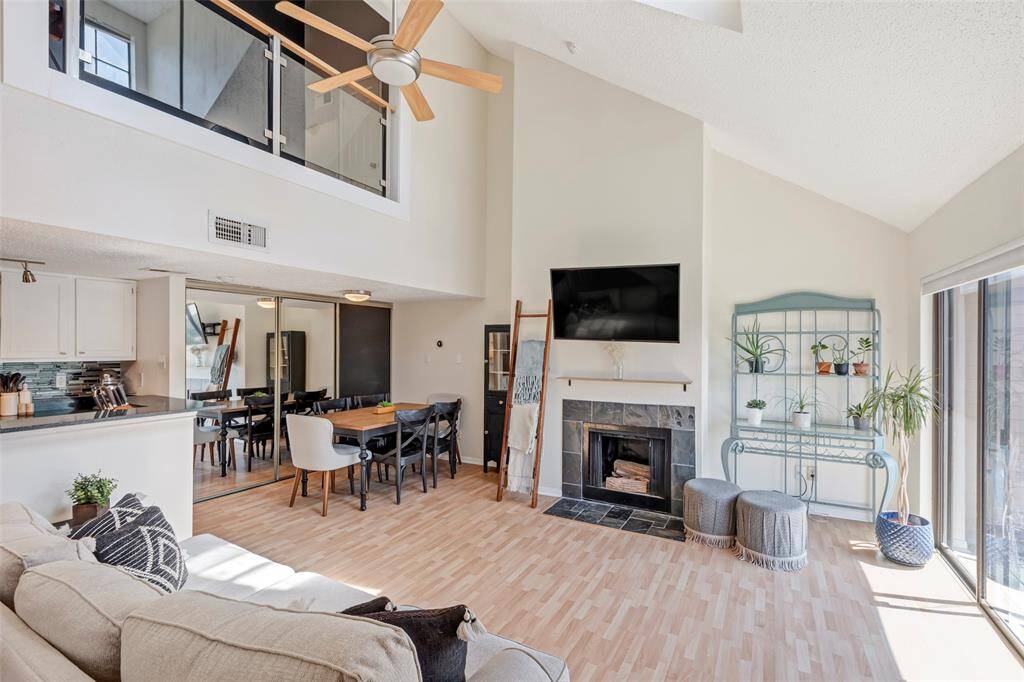 Welcoming entry with a view into the cozy bedroom to the left and a staircase leading to the upper level.