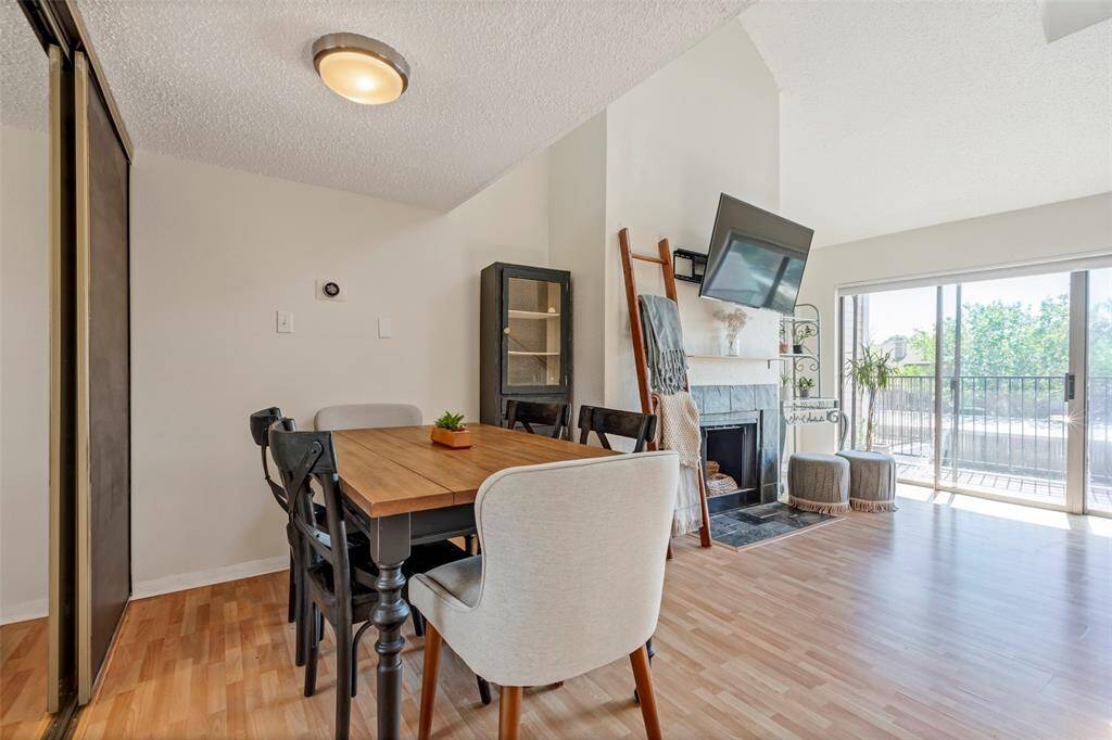 Cozy dining area, conveniently located beside the kitchen and nestled in the corner of the living room.