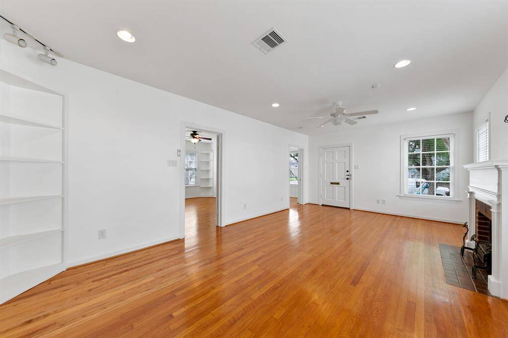 Everything has just been painted white, and the floors are gleaming hardwoods besides the office/2nd bedroom which has brand new laminate.