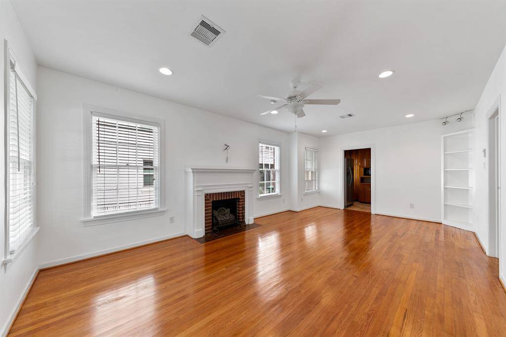 The opening center right is the entrance to the primary bedroom, bath and laundry area. The doorway straight ahead leads to the kitchen