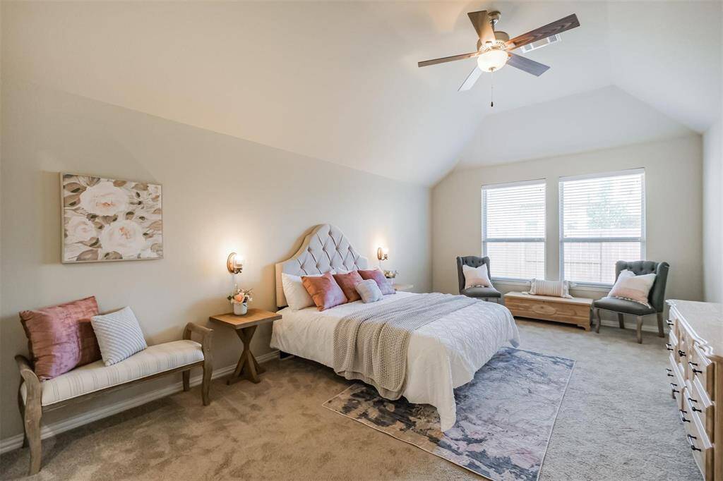 Primary Suite is large andinviting with ceiling fan and highceilings.