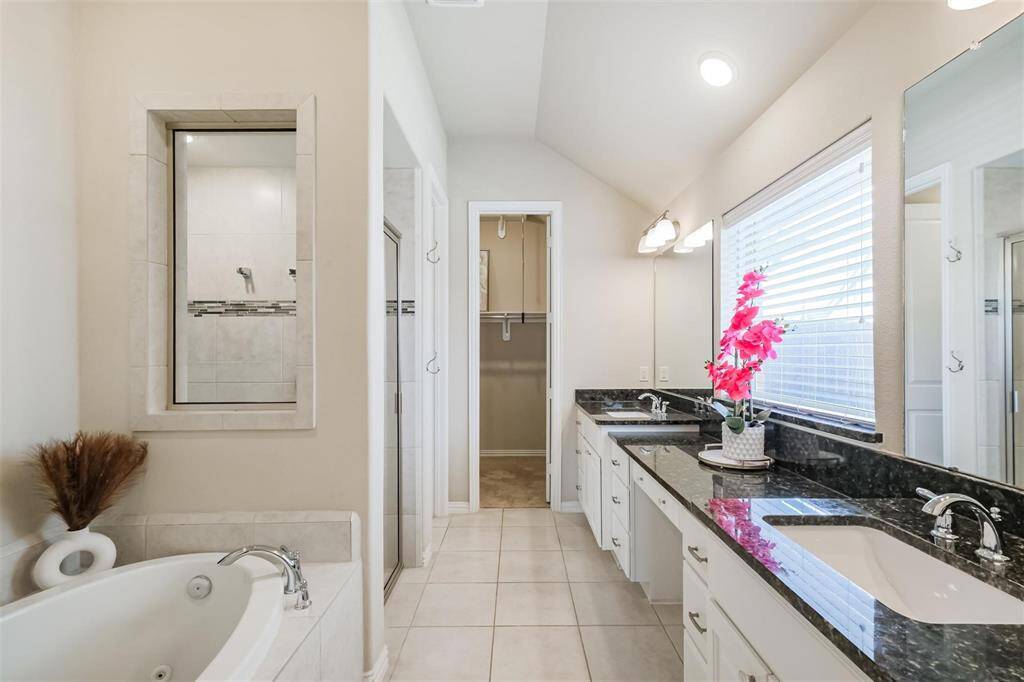 Dual vanities, soaking tub, largewalk in shower and beautifulfinishes.