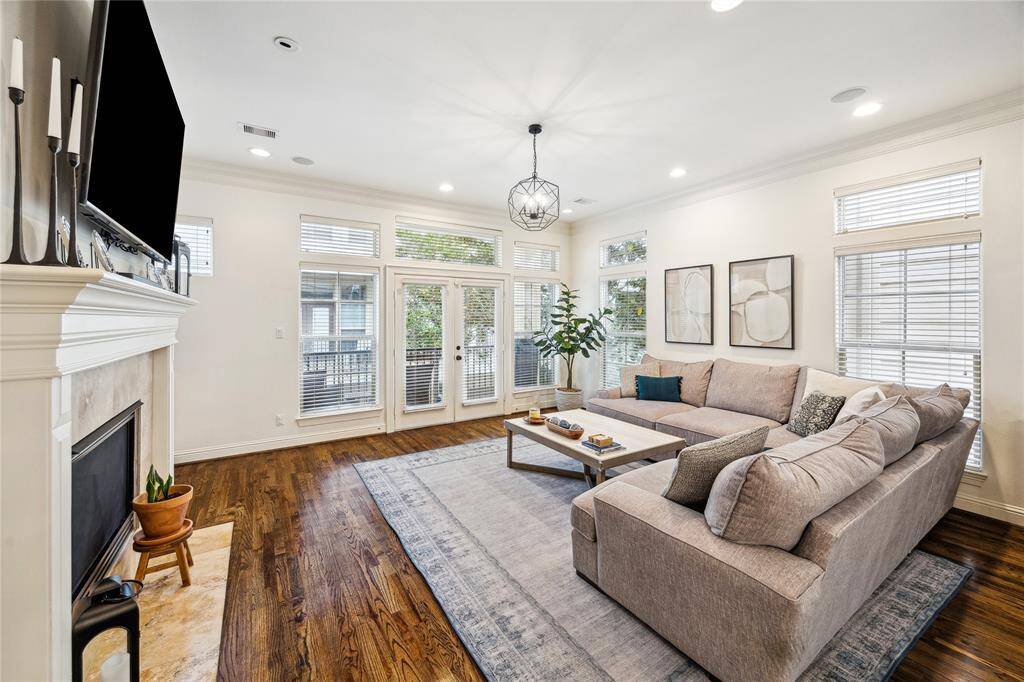 This large space has lots of natural light and double French doors that lead to a balcony.