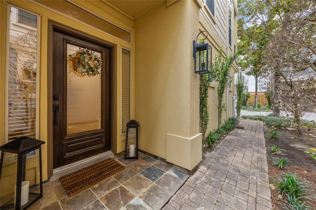 The private entry with slate tile flooring leads to a lovely foyer.