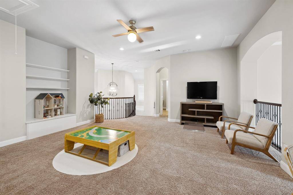 Oversized game room with open shelving and a storage closet