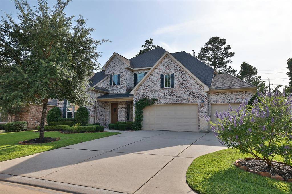 Extra wide driveway leading to true 3-car garage