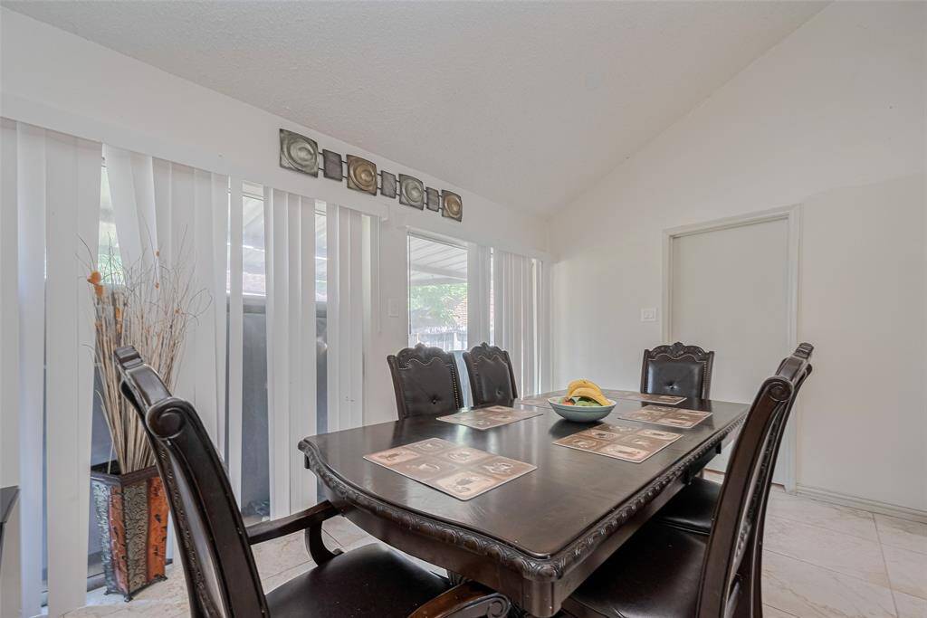 High ceilings and open living-dining layout make the space feel bright and welcoming.