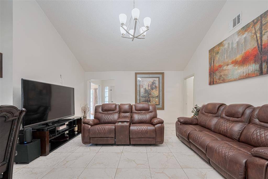 Dining area with windows that bring in natural light and offer peaceful views outside.