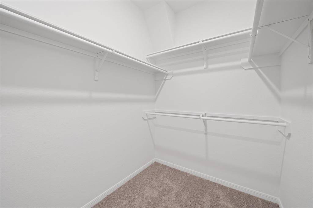 A view of your large primary walk-in Closet