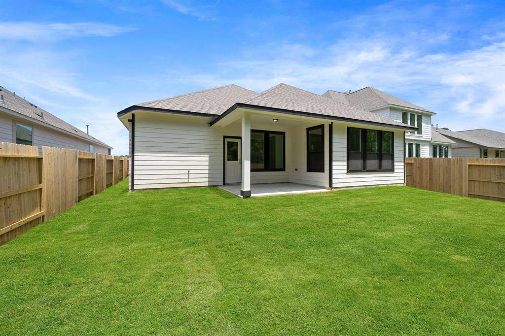 This backyard is perfect for family gatherings, social events, or simply unwinding in the fresh air.