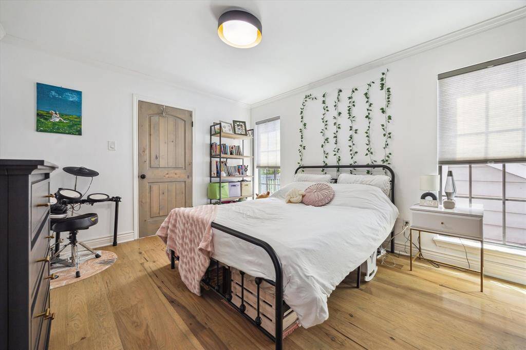 This secondary bedroom is so bright and inviting with all of its natural light and ensuite bath