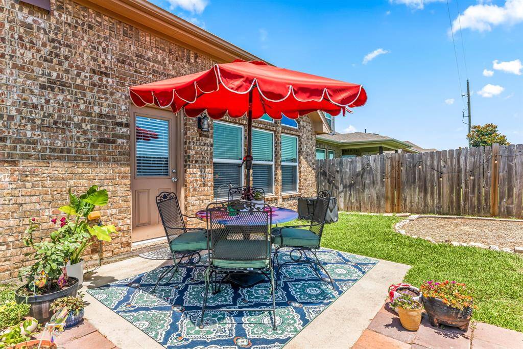 This backyard oasis offers a peaceful escape with a blend of greenery, privacy fencing, and space to relax, play, or personalize to your lifestyle.