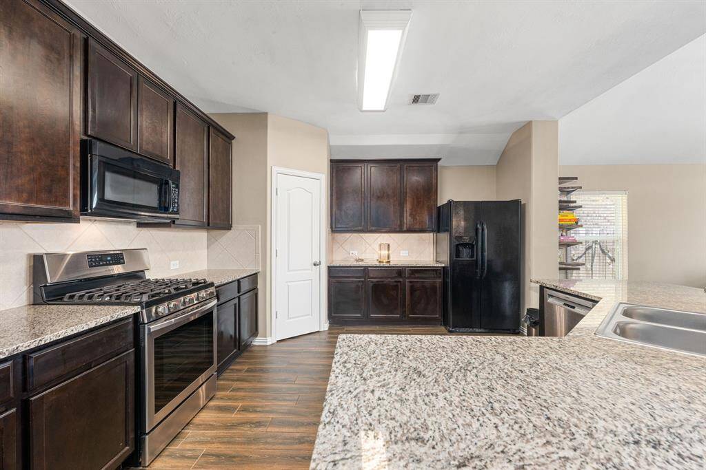 Any chef's dream, this stunning kitchen is perfect for everyday life as well as entertaining family and friends! This spacioud kitchen provides plenty of counter and cabinet space for all your needs. *Virtually Staged