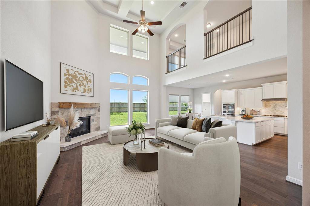 This home is designed for effortless connection, featuring a perfectly integrated family room, chef's kitchen, eat-in breakfast area with an uninterrupted view of the serene backyard and entertainment space. The fireplace features an upgraded cedar mantle perfectly paired with the warmth of the stone surround! Whether hosting guests or enjoying quality time with loved ones, this seamless layout fosters interaction and comfort at every turn. The open-concept design allows entertaining to feel effortless!