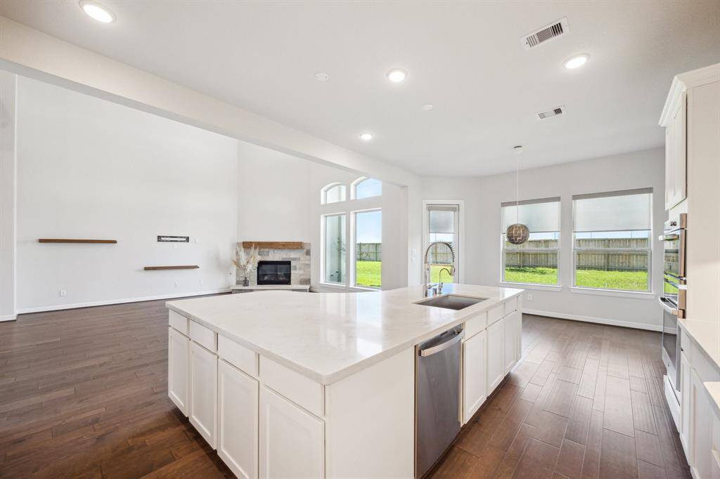 Perfectly positioned for both connection and convenience, this thoughtfully designed kitchen allows the chef to engage with guests while preparing meals. Overlooking a stunning backyard oasis, it enhances everyday moments—whether hosting lively gatherings or enjoying a peaceful view. As the heart of the home, it seamlessly blends cooking, conversation, and relaxation.