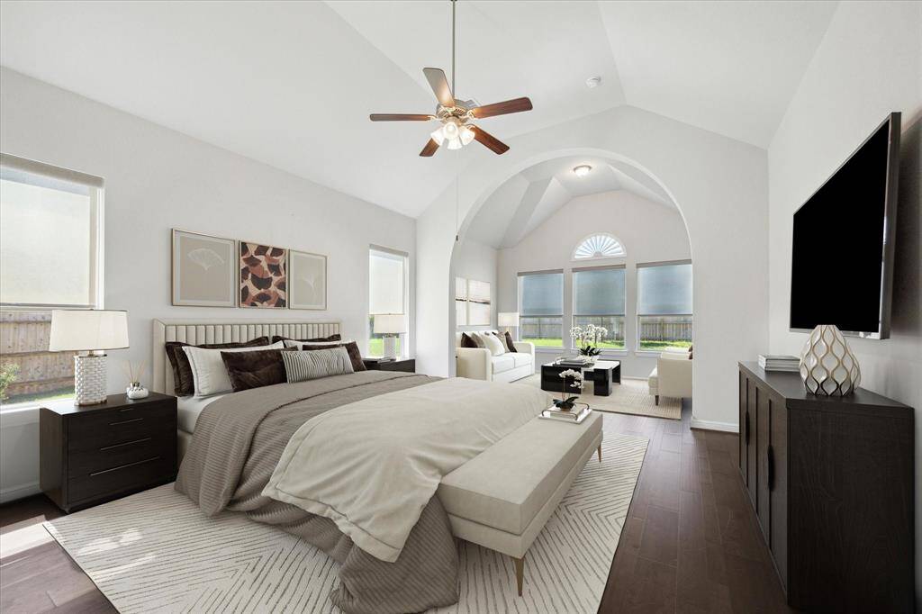 This luxurious primary suite is truly fit for a king and queen. The spacious layout includes a charming private sitting area, perfect for unwinding with a book, enjoying a peaceful moment or morning cup of coffee.  With refined finishes and thoughtful details, this serene haven combines beauty and relaxation, creating the ultimate personal escape