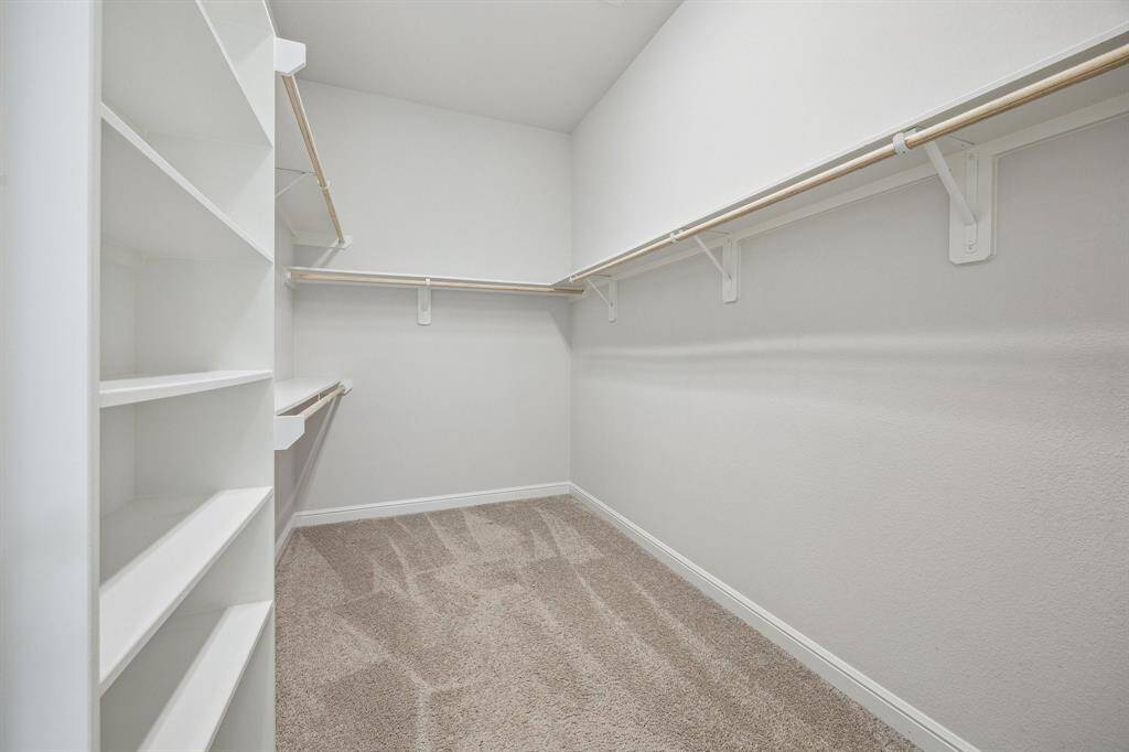 The expansive separate his-and-her walk-in closets offer the perfect combination of style and functionality. Designed for convenience, it provides generous storage space for clothing, accessories, and more—ensuring a clutter-free and organized lifestyle. With separate areas tailored for each person, this thoughtfully crafted closet allows for easy customization while adding an extra touch of luxury to daily routines. A must-have feature for effortless organization and comfort!