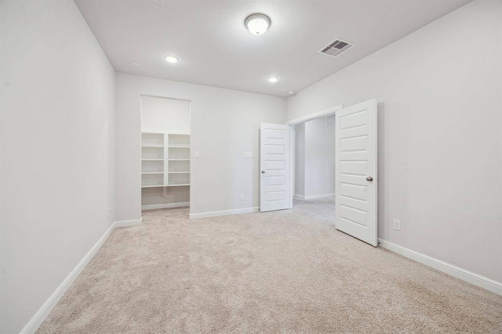 This media room offers the best of both worlds—generous space for entertainment while maintaining the perfect level of privacy for immersive movie nights.  Built-in shelves dedicated to storing media artifacts and or board games perfect for hosting a family film marathon or enjoying a quiet evening with a blockbuster, this dedicated space ensures a fun cinematic experience.
