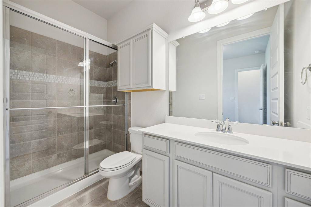 This impressive guest ensuite bath is designed to deliver both style and comfort, creating a private retreat within the home. Thoughtfully curated finishes, elegant fixtures, and a spa-like ambiance elevate the space, ensuring a luxurious experience for its future owner.